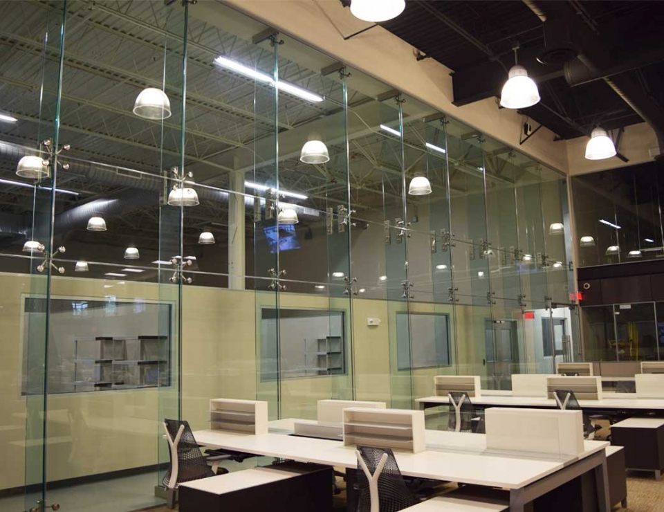 Team installing structural glass wall